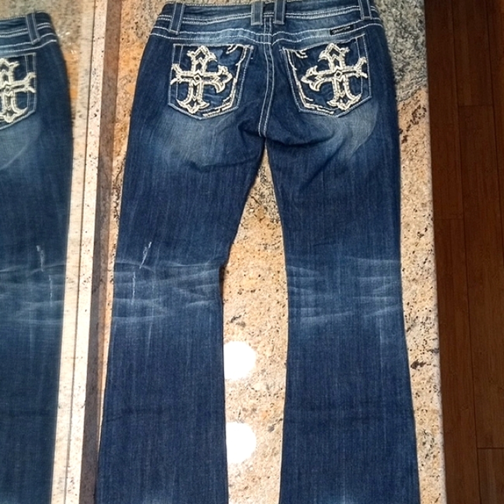 Miss Me Lightly Distressed Blue Boot Cut Jeans with Embroidered Details. Size 28